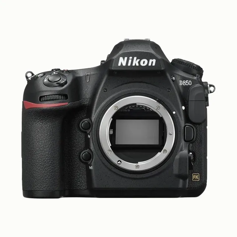 DSLR camera body, front view showing the pentaprism housing and lens mount.